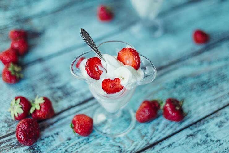 Place the Strawberries With Any Juices, Ice Cream, and Milk in a Blender