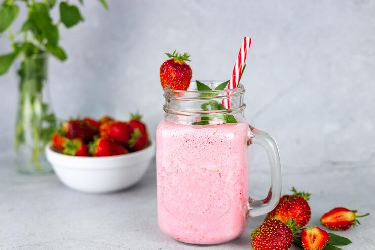  Pour Into Large Glasses and, if Desired, Put a Strawberry on the Rim of Each Glass